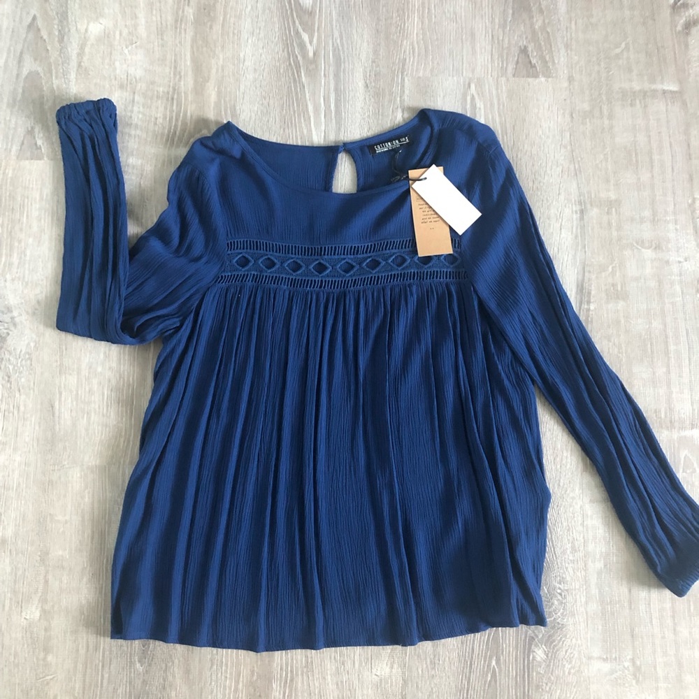 Blue long sleeve top.